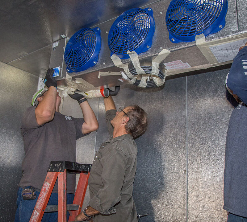 Commercial Refrigeration Installation - Chic-Fil-A Walk-In-Freezer installing the condenser