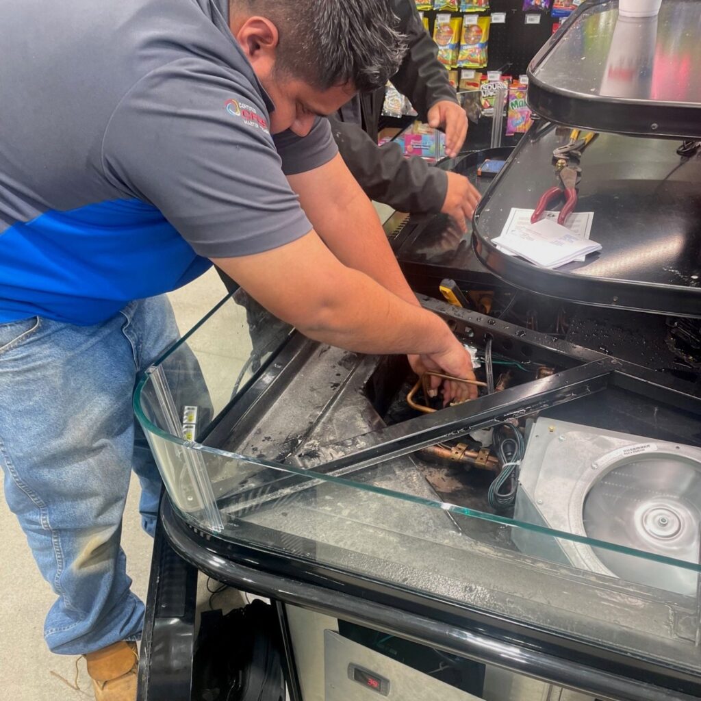 RSI Technician repairing refrigeration unit